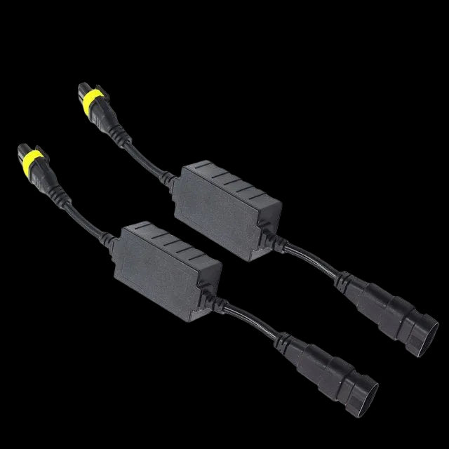 Two black solar power adapter boxes with yellow ring accents on their connector cables, shown on a plain white background.