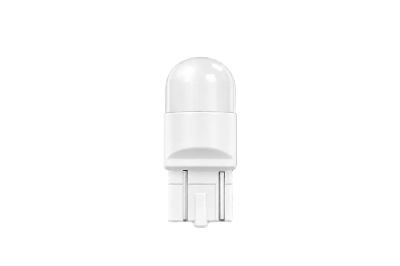 A white LED light bulb with a dome-shaped lens and a two-pin base, centered against a solid black background.