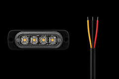 A black rectangular LED light module with four illuminated yellow-orange LEDs on the front, shown next to a black cable with three exposed wires in yellow, black, and red, against a solid black background.