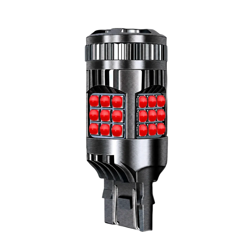 A single automotive LED light bulb with a brushed silver metal body and four red square LEDs visible on each side, shown against a solid black background.