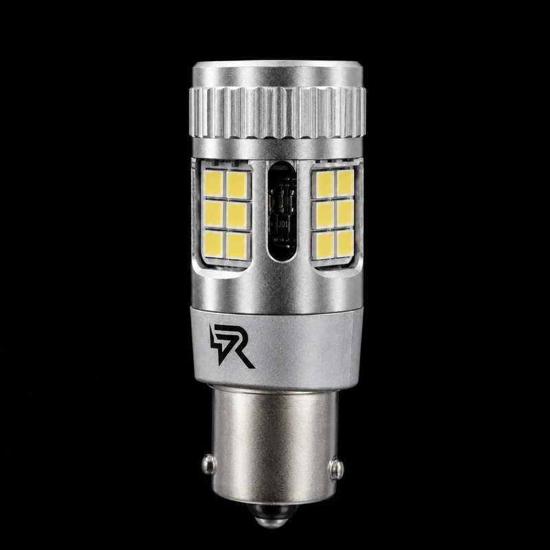 A silver metal LED car light bulb with yellow LED chips, shown vertically against a solid black background.