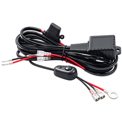Black electrical wiring harness with a toggle switch, fuse connectors, and red wire leads on a white background.