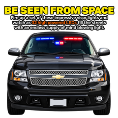A black Chevrolet pickup truck shown from the front on a white background, with large promotional text above reading 'BE SEEN FROM SPACE' and describing red and blue visor lights. The truck has red and blue LED lights illuminated across the windshield.