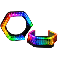 Two hexagonal LED light bars with a black frame, one standing upright and the other lying down, both illuminated with a rainbow color spectrum on a gray checkered background.