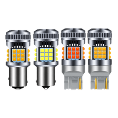 Four LED car light bulbs arranged side by side on a plain white background, showing different light outputs and bulb types.