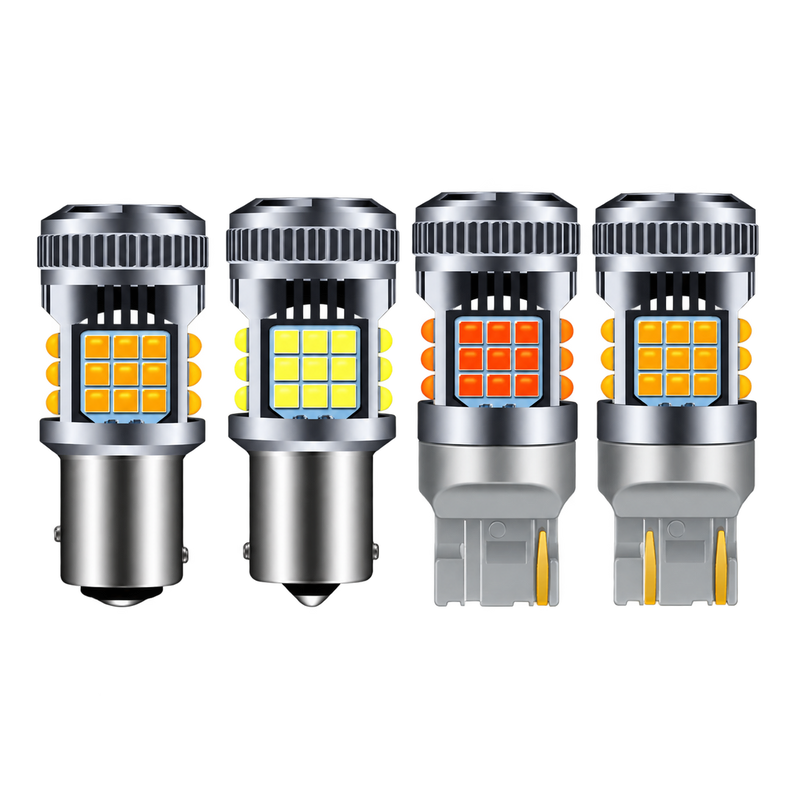 Four LED car light bulbs arranged side by side on a plain white background, showing different light outputs and bulb types.