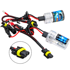 A pair of automotive HID/LED headlight conversion kits with clear glass bulbs, black wiring, red and black wires, and yellow ring connectors, shown on a white background with a circular inset detail of the connector.