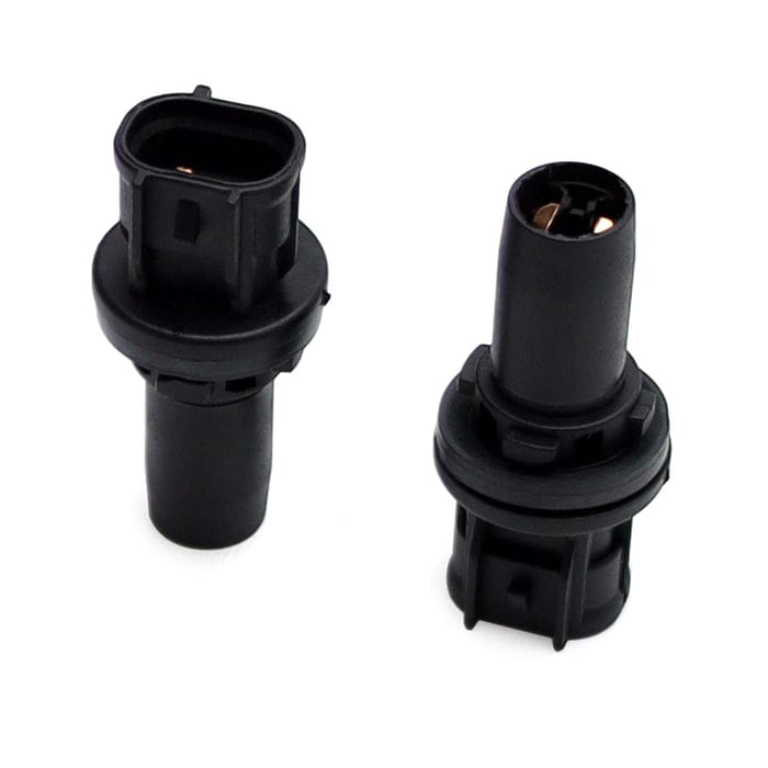 Two black plastic automotive electrical connector components shown on a plain white background.