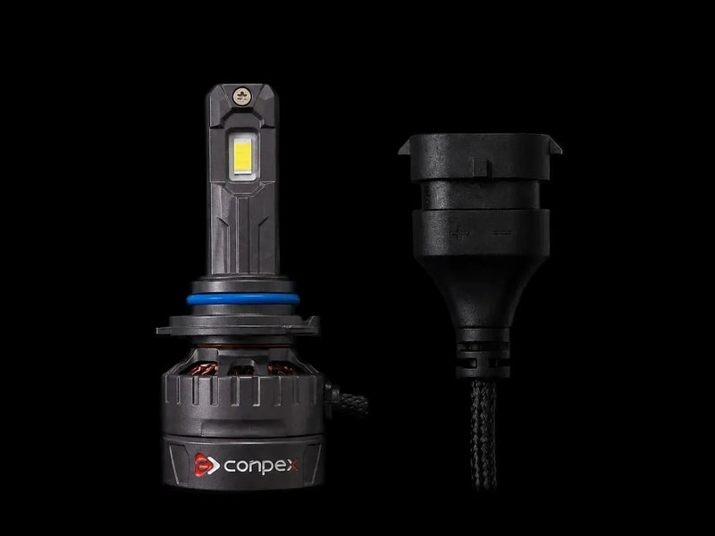 A ConpeX LED car headlight bulb shown next to its black plastic connector housing and cable on a solid black background.