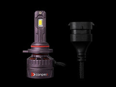 A Conpex LED automotive light bulb shown next to its black electrical connector plug on a solid black background.