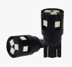 Two black LED window light bulbs with multiple white square LED chips, shown on a plain light gray background.