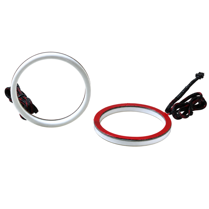 A white circular ring light accessory shown disassembled on a plain white background, with two black wiring cords visible and a red inner ring component.