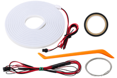 An LED light strip kit with a coiled white flexible light strip, red and black wires with connectors, a black tape roll, an orange plastic tool, and a metal wire loop, all on a white background.